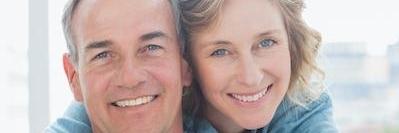 older couple with cosmetic dentistry smiling in charlestown