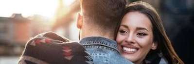 Two people hugging outdoors | charlestown nsw dentist