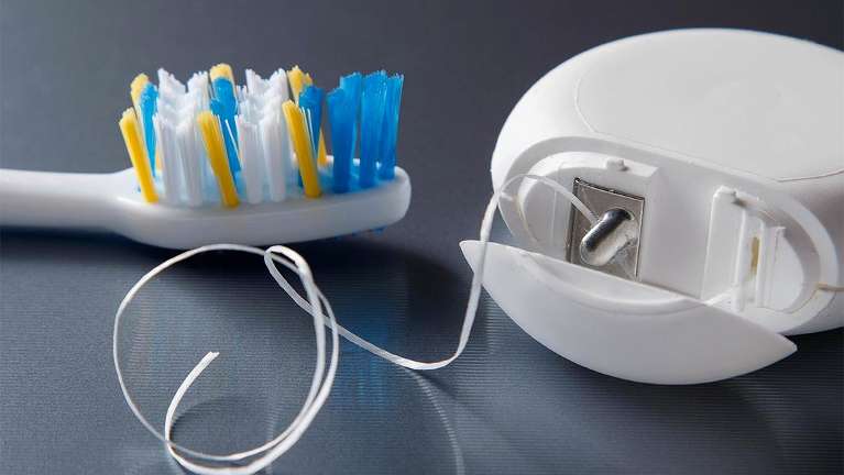 Floss and a toothbrush