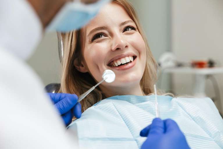 woman with good oral receiving a professional teeth cleaning in Charlestown NSW