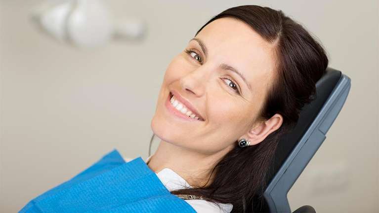 Woman getting a dental exam | Charlestown Dental Care