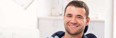Man smiling in dental office | Charlestown Dentist